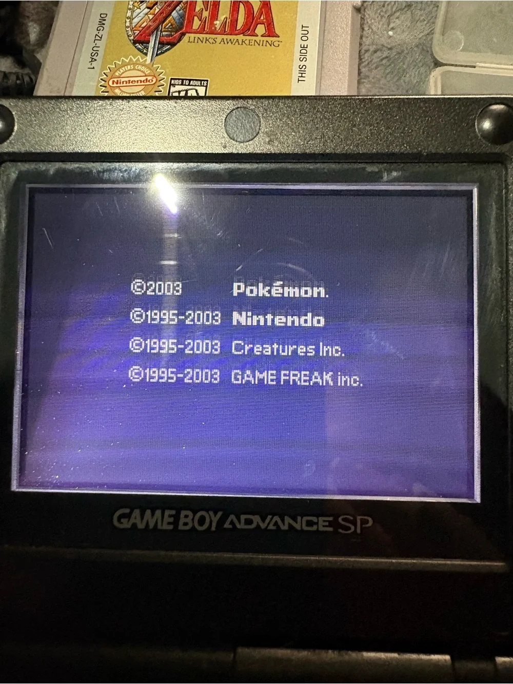 Nintendo Game Boy Advance SP Black with Pokémon sapphire, Zelda, Care Bears
